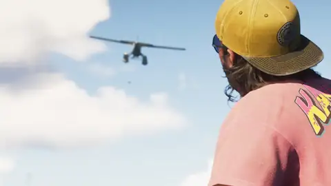 a man in a yellow cap watching a seaplane fly overhead in an official GTA 6 screenshot