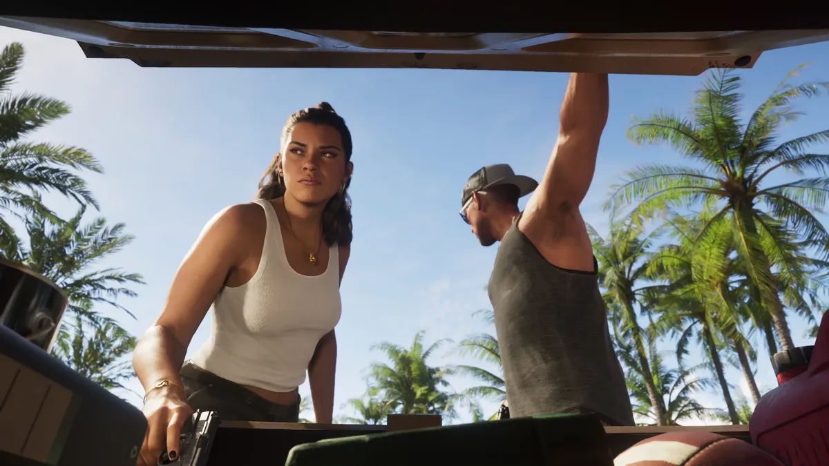 Lucia and Jason at the open boot of a car under palm trees in an official GTA 6 screenshot