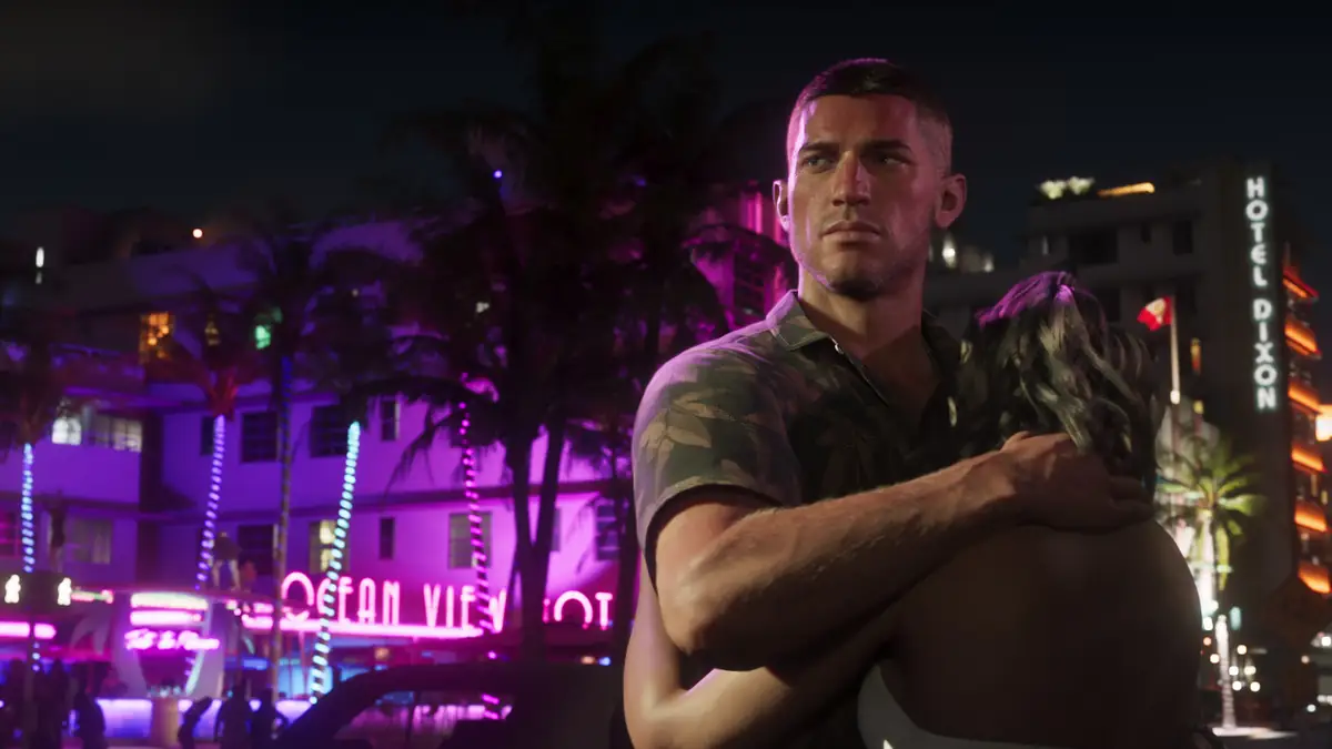 a man in an olive shirt on a neon lit Vice City street at night in an official GTA 6 screenshot