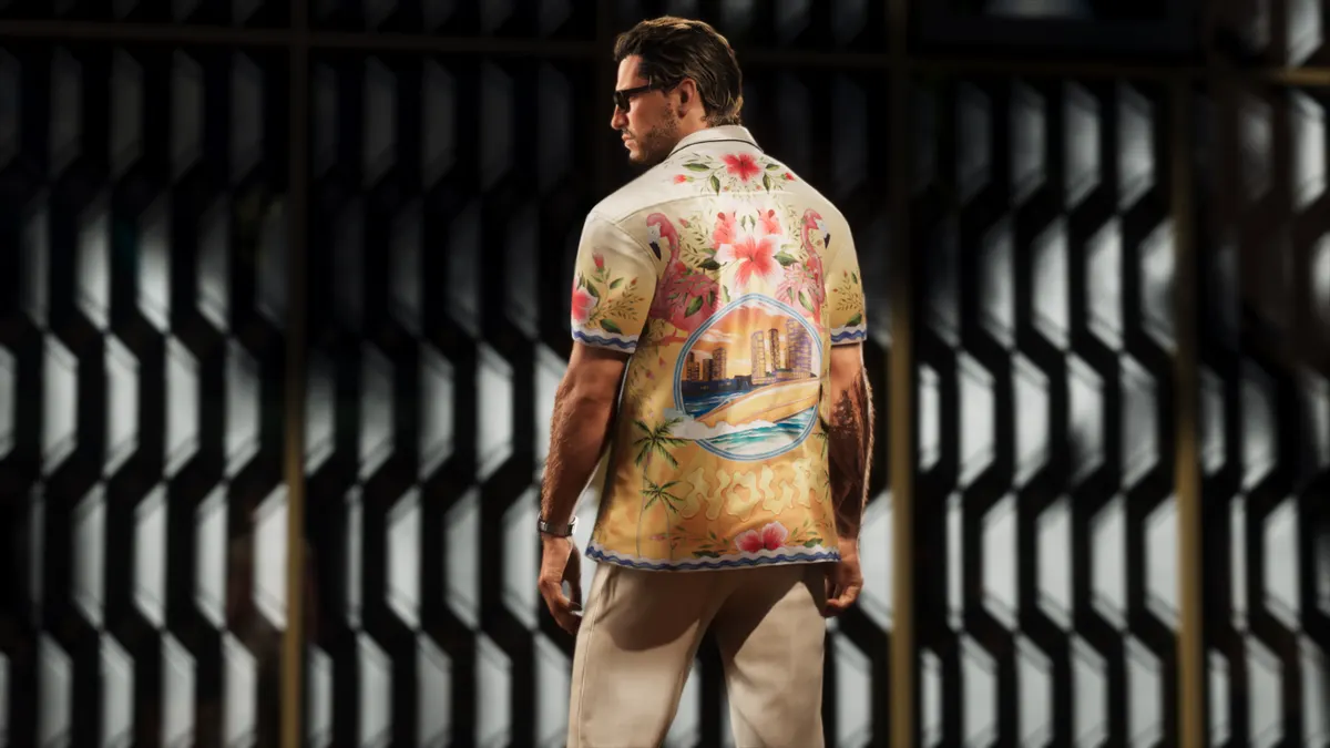 a man seen from behind in a bright floral shirt against a dark slatted wall in a Rockstar Games image for GTA 6