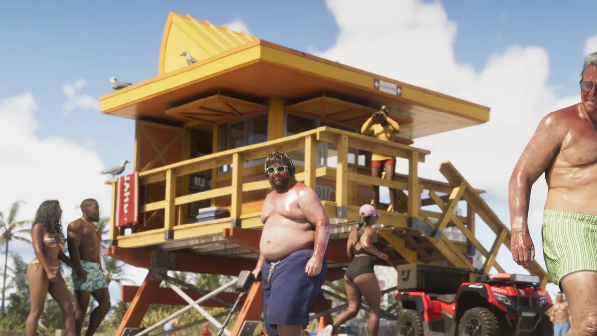 a yellow lifeguard tower on a busy white sand beach with sunbathers and a red quad bike in a Rockstar Games screenshot for GTA 6