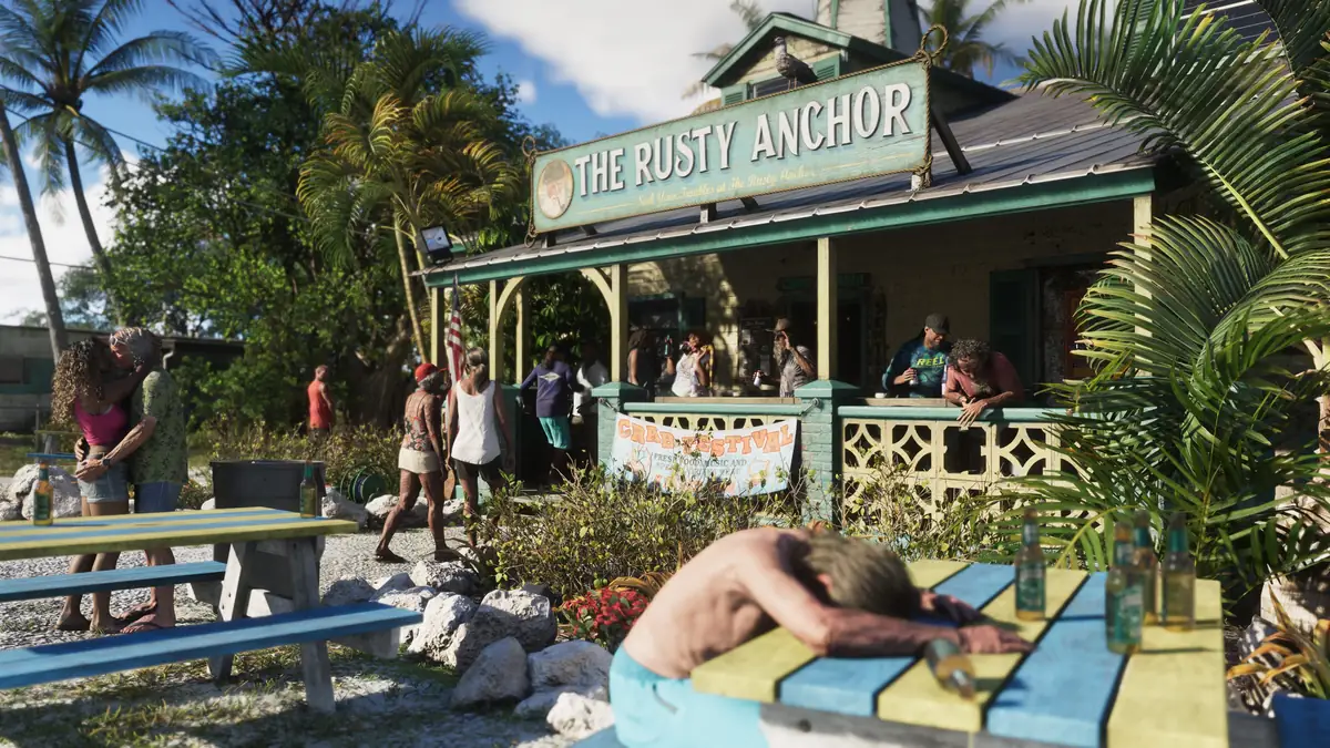 people drinking at the Rusty Anchor bar while a man sleeps face down on a table in the Leonida Keys in a Rockstar Games screenshot for GTA 6