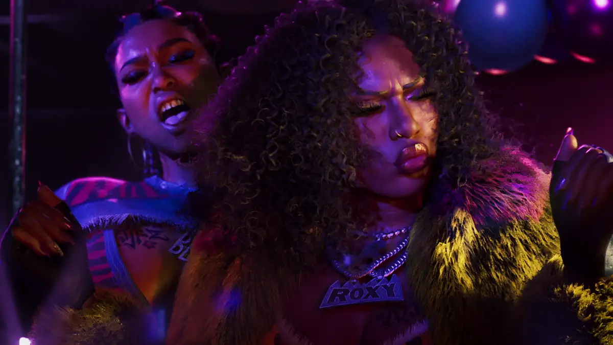two women dancing under purple club lights in an official GTA 6 screenshot of a Vice City nightclub